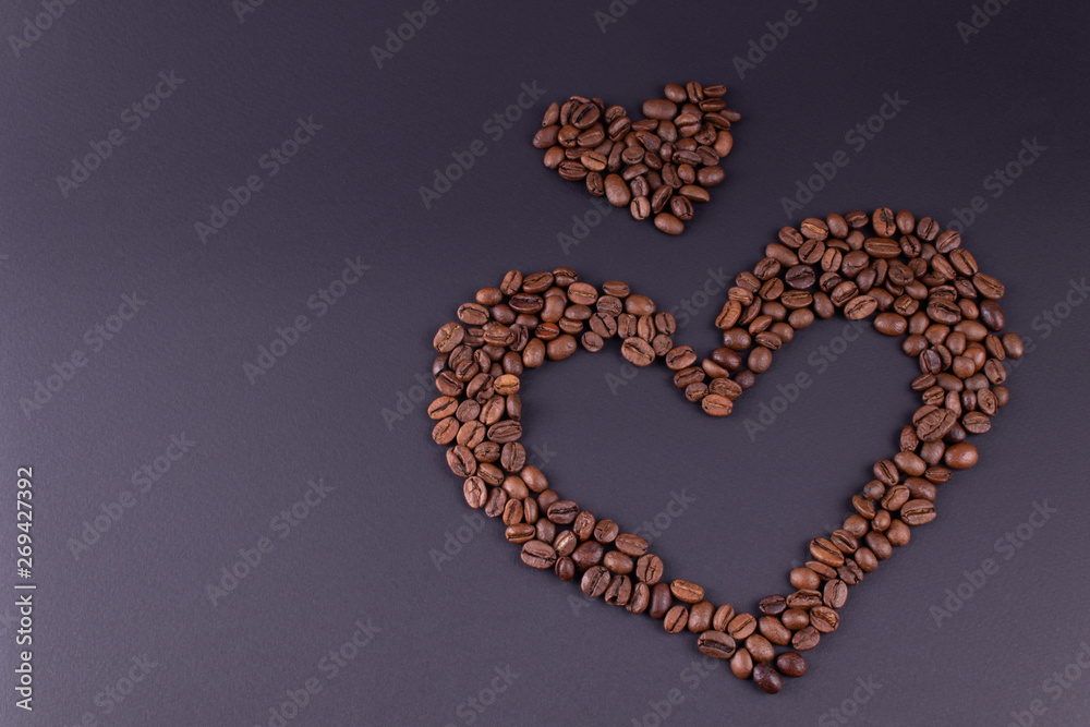 Two hearts lined from coffee are located to the right of the center of the background Two hearts lined from coffee are located to the right of the center of the background