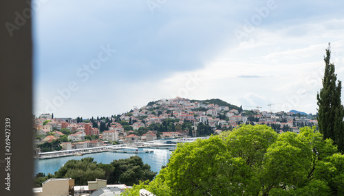 Gruž, a neighborhood in Dubrovnik, Croatia, Adriatic sea. Harbor and bay. Harbor boats. Port, harbor, ferry terminal, cruise port. Yacht Club. A harbor with white boats and yachts. Cruise ships