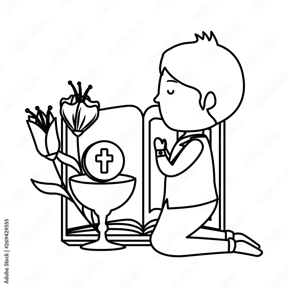 little boy kneeling with book and chalice first communion
