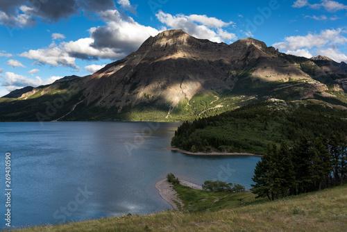 Lake with mountain range in the background  Waterton Park  Alberta  Canada