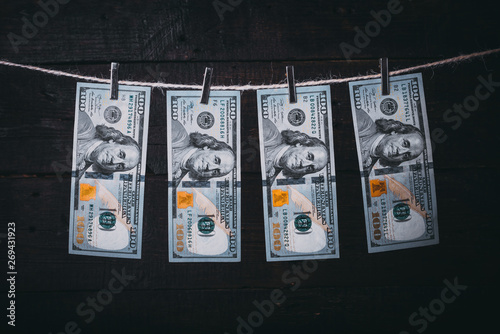 Money Laundering. Money Laundering US dollars hung out to dry. 100 dollar bills hanging on clotheslines