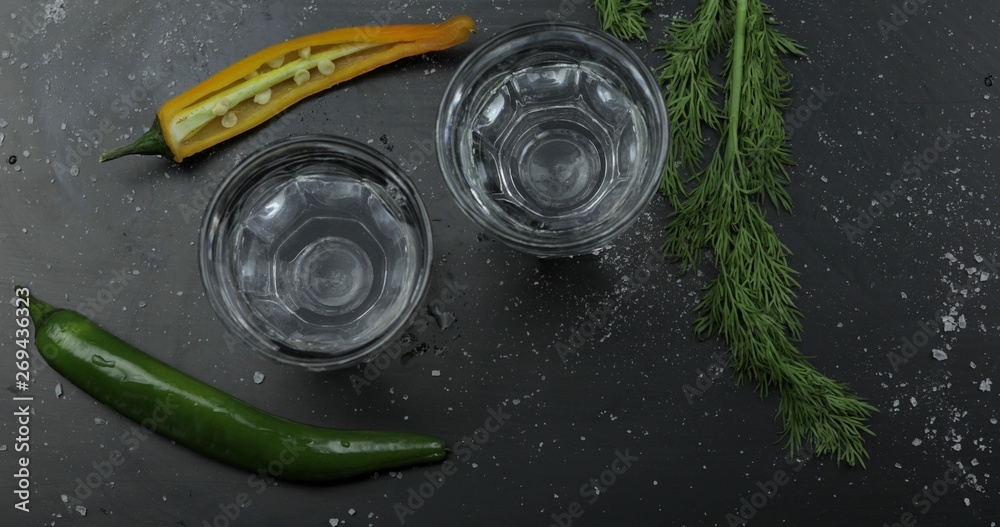 Alcohol drink vodka in shot glasses. Surface with snacks. View from top Alcohol drink vodka in shot glasses. Surface with snacks. View from top