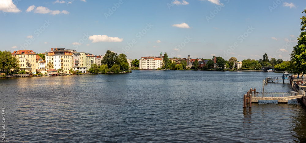 Obraz premium Romantic views of the river Dahme and Spree in Berlin Koepenick with houses on the shore, bridges, ships and boats
