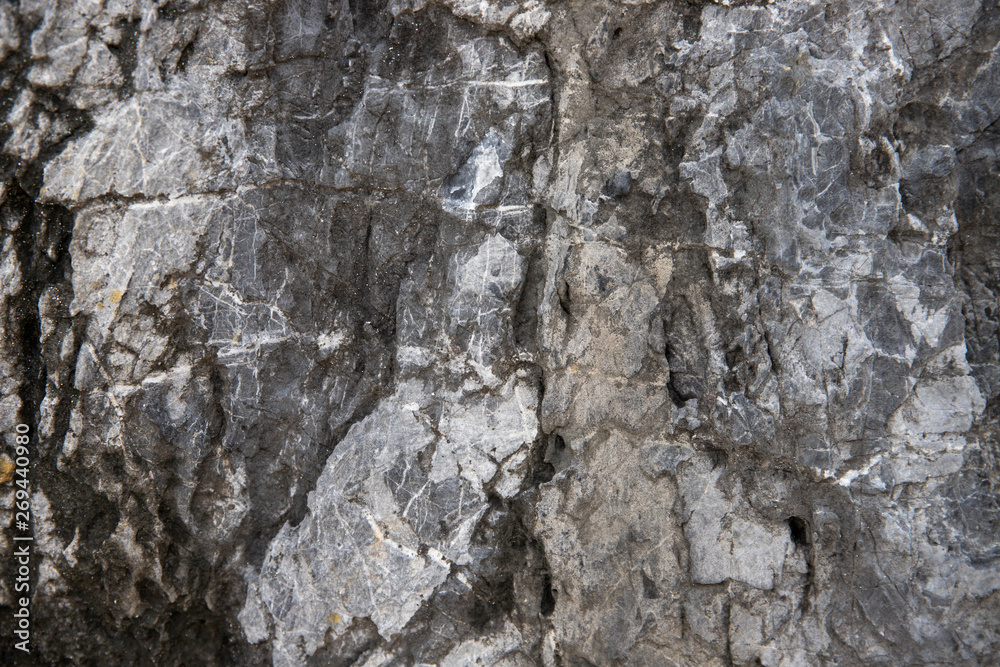 Cracked stone texture background. Distressed natural surface. Eco design template. Volcanic rock cracked surface Cracked stone texture background. Distressed natural surface. Eco design template. Volcanic rock cracked surface