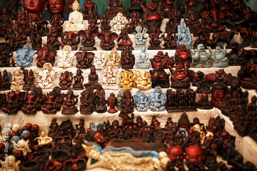 Indian gods souvenirs on the counter of the night market for tourists
