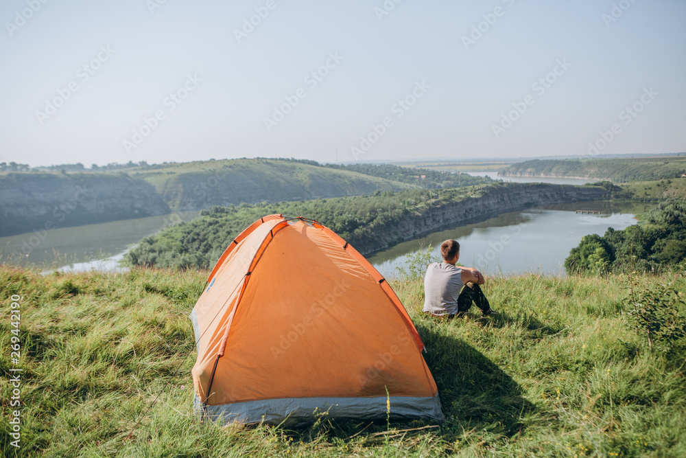 man tent camp landscape rocky canyon river