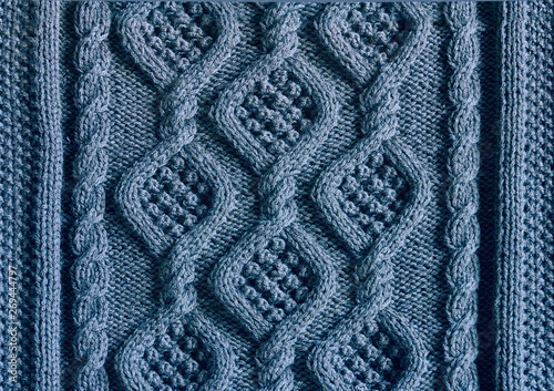 background texture knitted canvas with patterns Aran closeup blue color