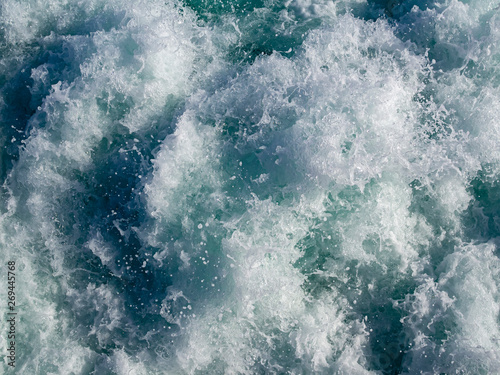 Water foaming behind a ferry boat
