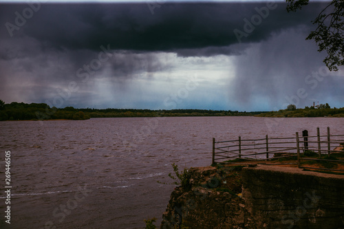 stormy sky over city promenade