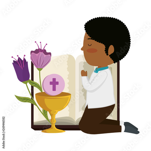 little black boy kneeling with book and chalice first communion