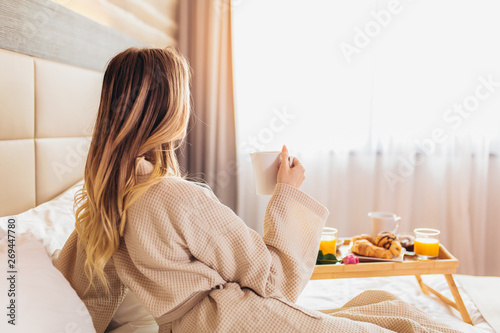 Breakfast in bed, cozy hotel room. concept photo