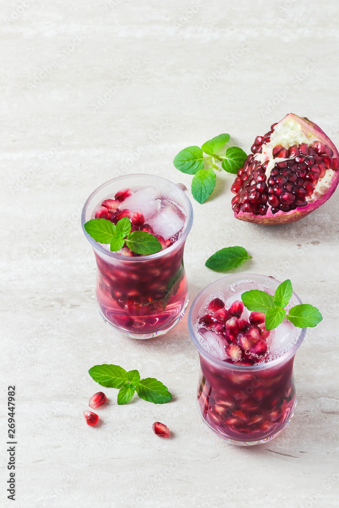 Pomegranate mojito cocktail. Top view, space for text. Pomegranate mojito cocktail. Top view, space for text.