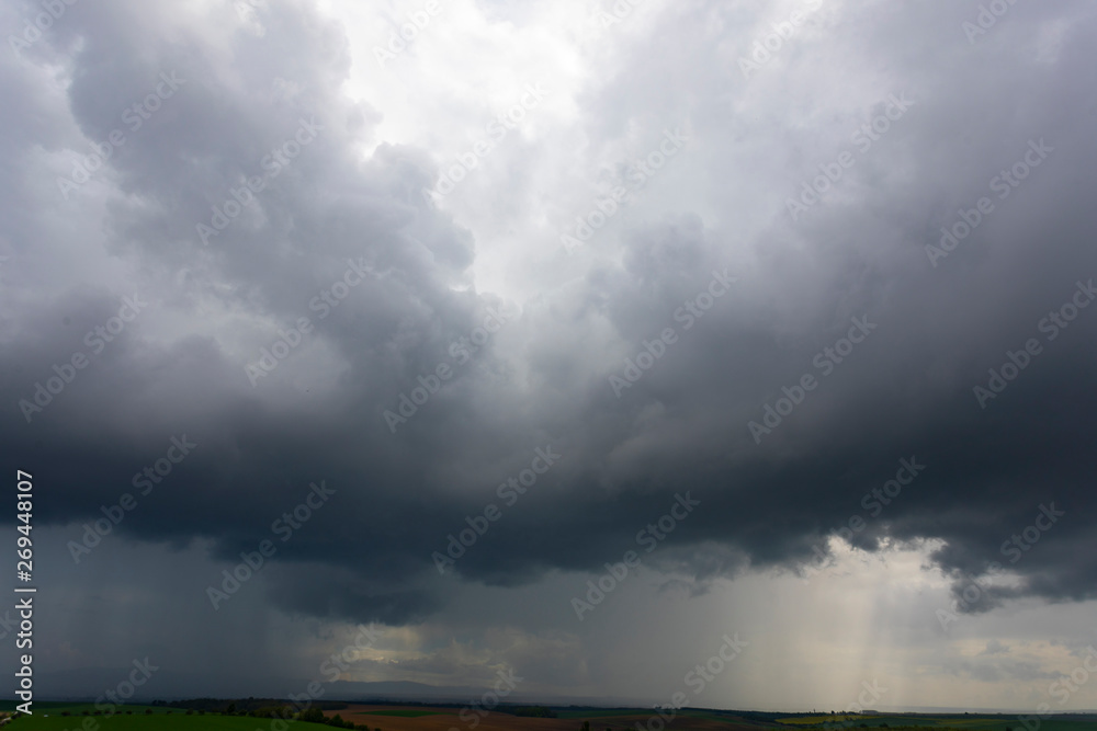 dramatic stormy sky with rain showers