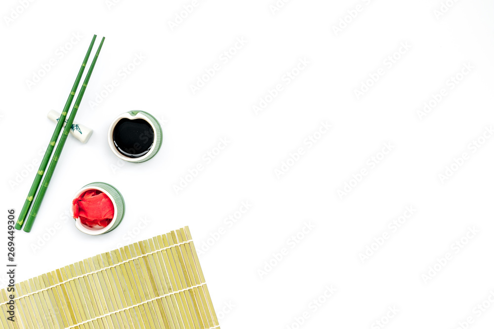 bamboo sticks, soy sauce, ginger for sushi and maki on white background top view mockup bamboo sticks, soy sauce, ginger for sushi and maki on white background top view mockup