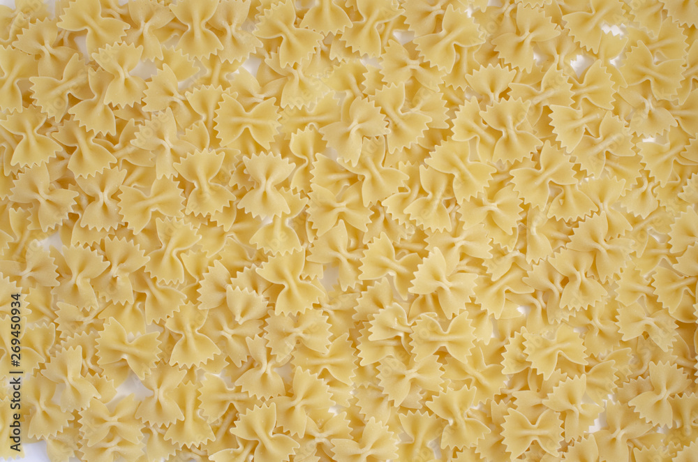 Italian uncooked pasta. Raw farfalle. Healthy food. Italian dishes. Italian uncooked pasta. Raw farfalle. Healthy food. Italian dishes.