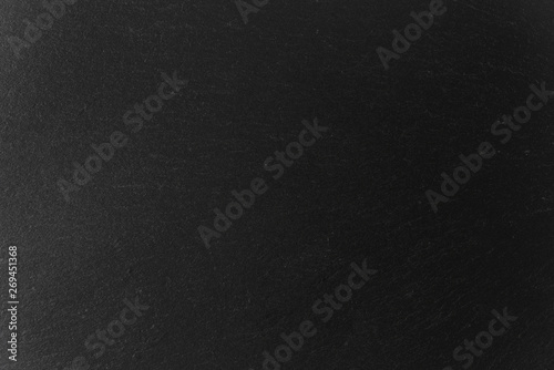 Abstract background of black slate stone texture and pattern 