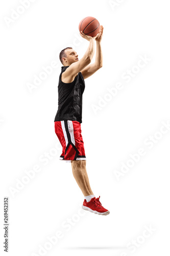 Male basketball player jumping and shooting a ball © Ljupco Smokovski