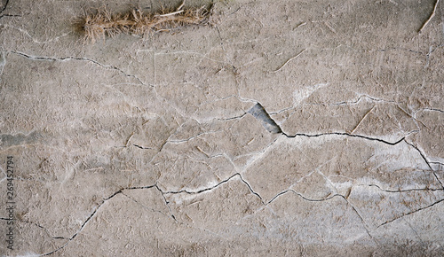 Rough cracked texture with gray and brown. Old concrete wall background.  © CaptureAndCompose