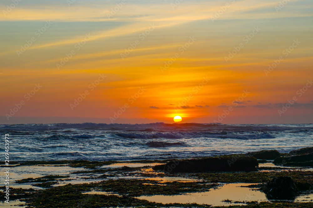 Sunset view from beach near Tanah Lot Temple in Bali Indonesia