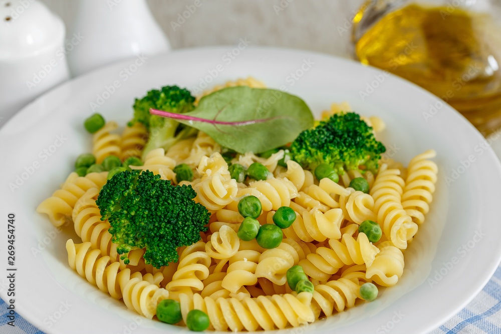 Pasta with broccoli and green peas