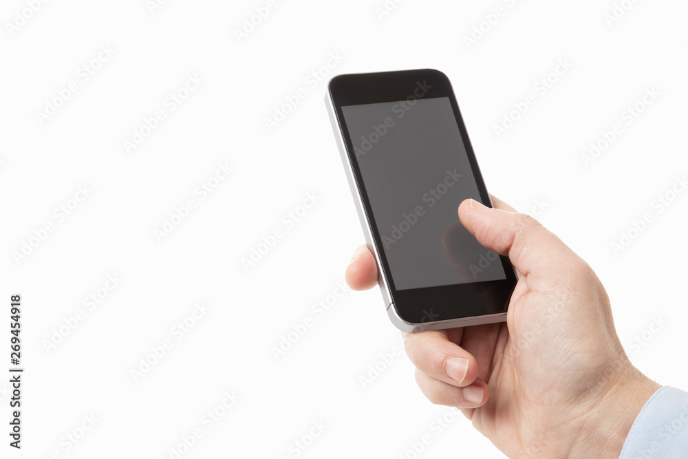 Handy in einer Hand, als Freisteller mit hellem Bildschirm Handy in einer Hand, als Freisteller mit hellem Bildschirm