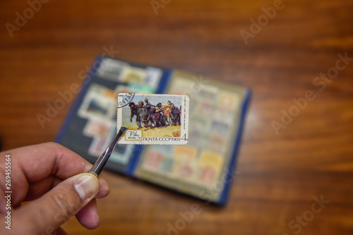 Old postage stamp on the table