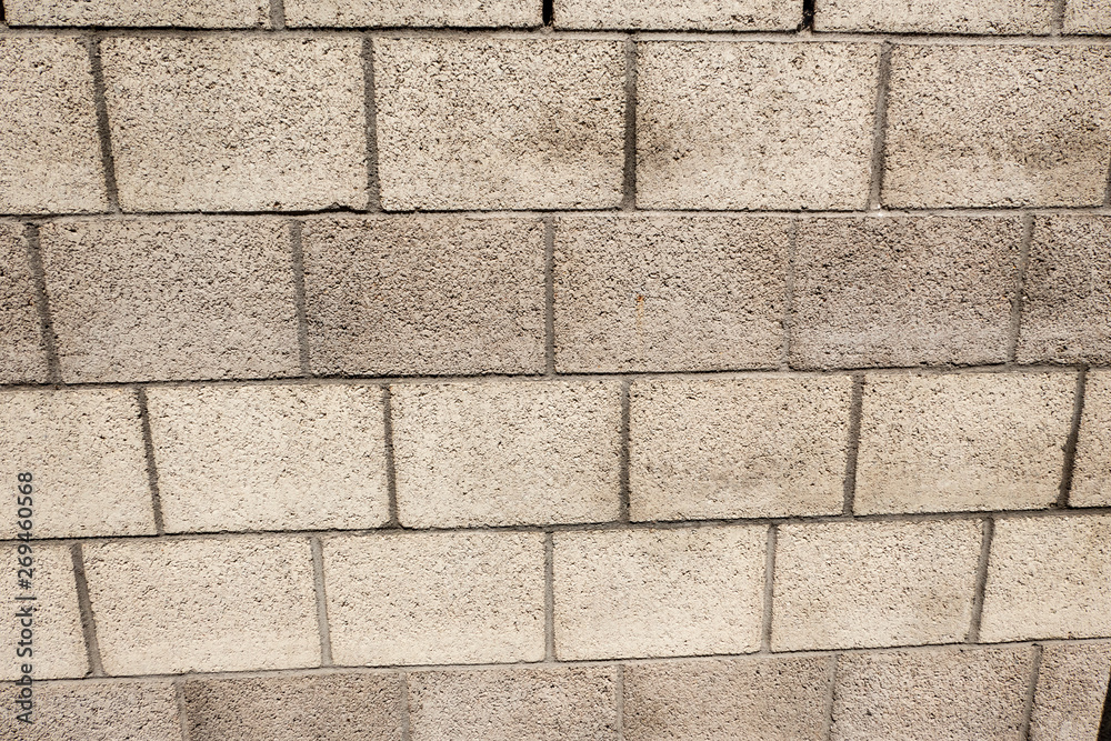 Obraz premium brick wall with rough stones background
