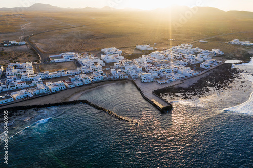 Spain, Canary Islands, Lanzarote, Caleta de Famara, sunset, aerial view photo