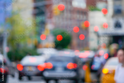 New York city street with traffic lights cars and buildings blurred with bokeh