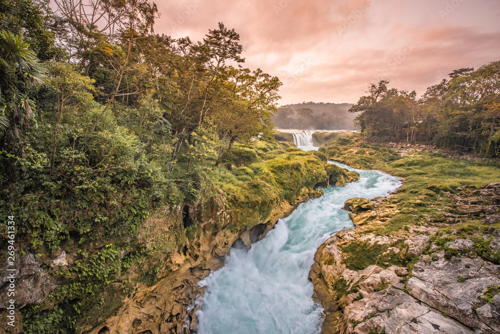 Amazing sunset over the turquoise waterfalls at Las Nubes in Chiapas, Mexico Amazing sunset over the turquoise waterfalls at Las Nubes in Chiapas, Mexico