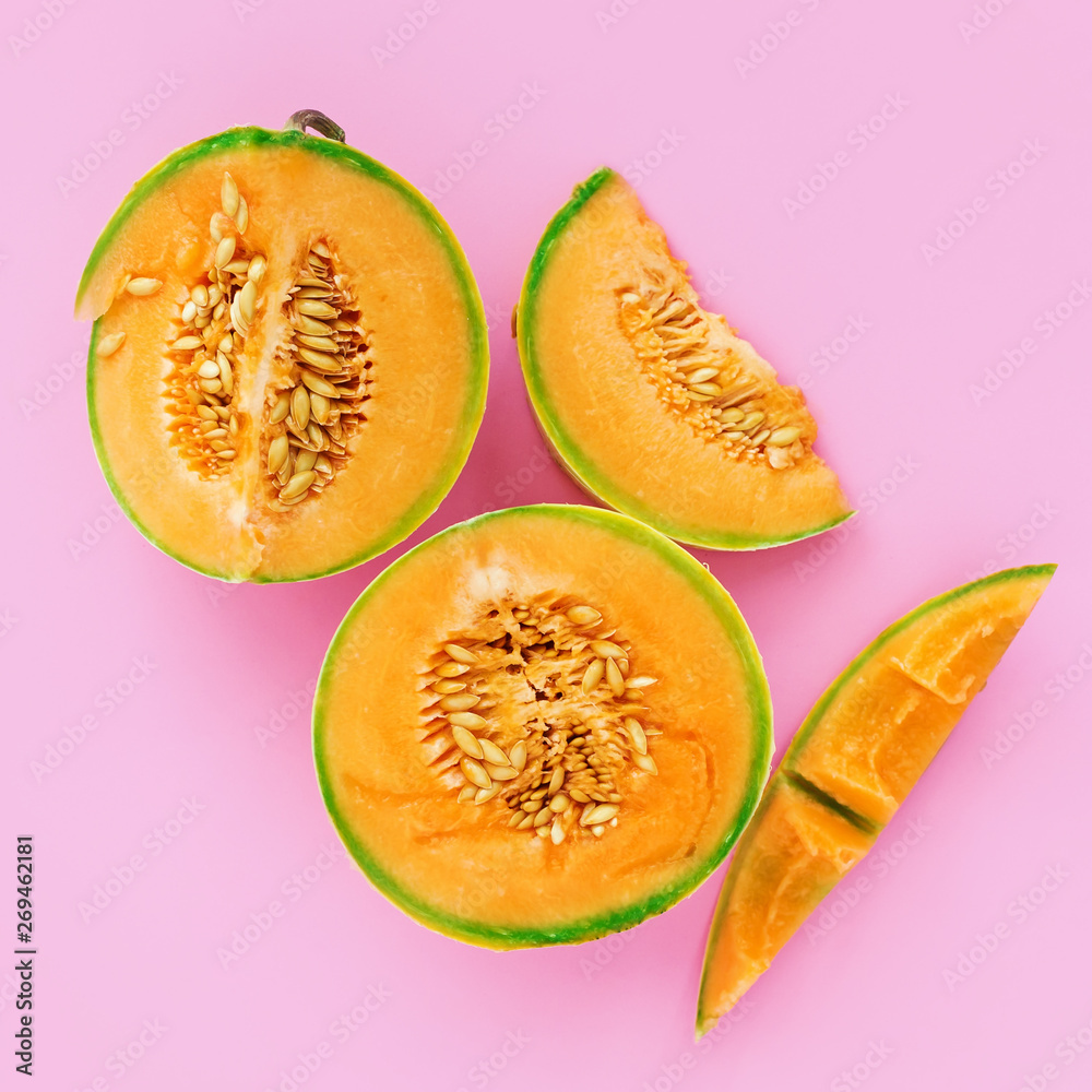 Yellow cantaloupe melon on pink background Yellow cantaloupe melon on pink background