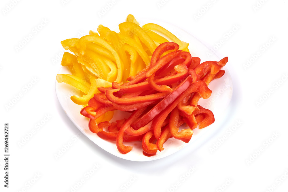 Sliced sweet red and yellow bell pepper, isolated on white background. Top view
