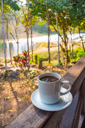 Coffee with a view, at background the turquoise waterfalls at Las Nubes in Chiapas, Mexico