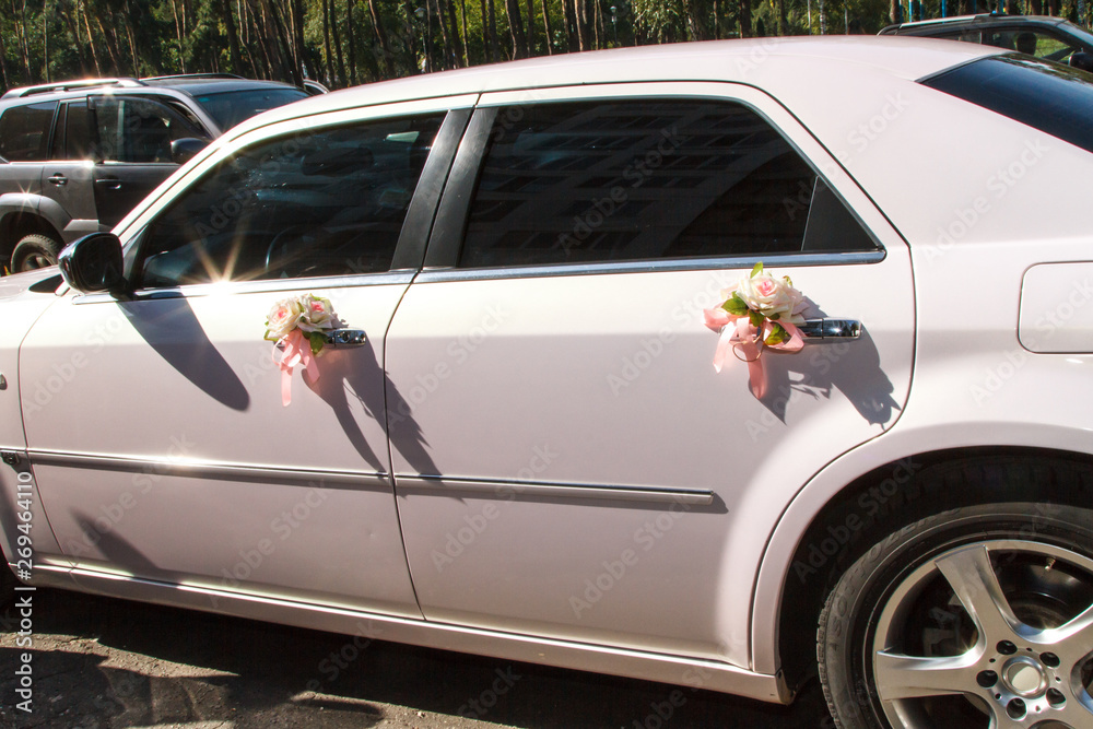 decor of two roses on a white car door