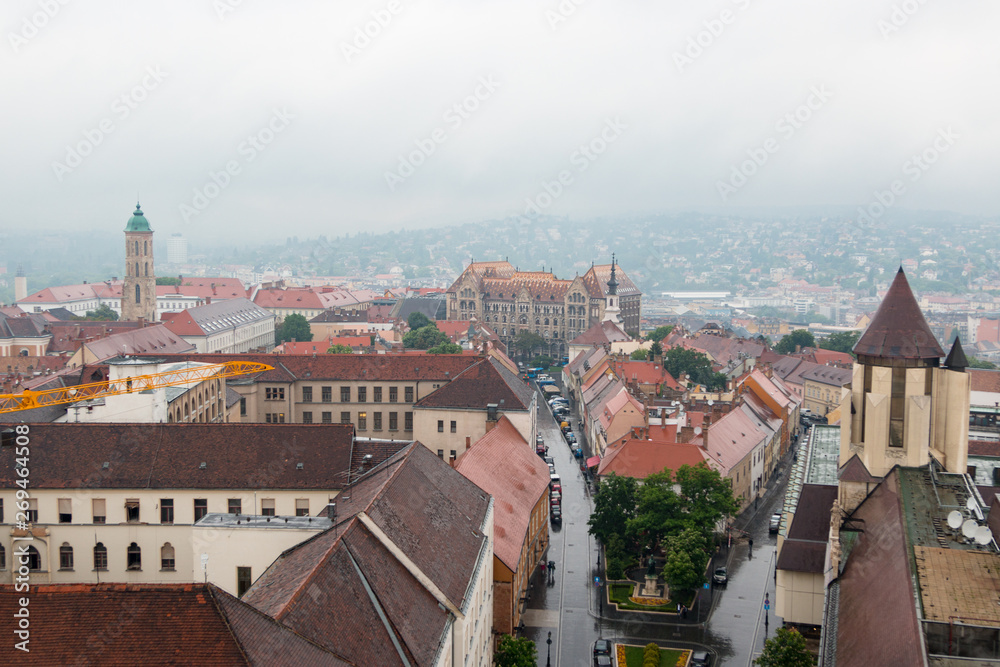 Budapest, Hungary. View of the city in cloudy weather from the tower of the Cathedral of St. Matthias. Danube River. Spring. Tourism and travel. Skyview. Top view.
