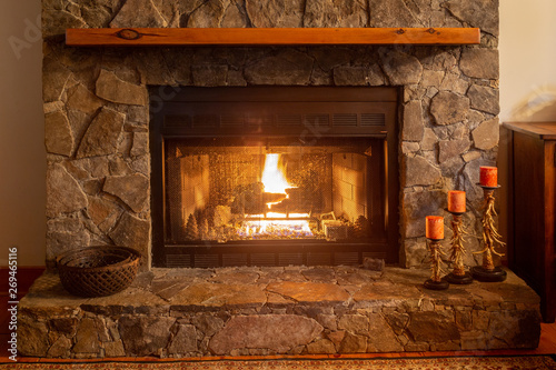 Fire in a cozy mountain cabin in the fireplace on a romantic night.