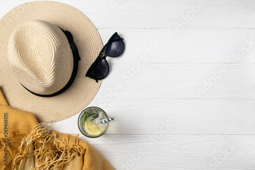 Summer beach pool composition with hat sunglasses refershing drink photo