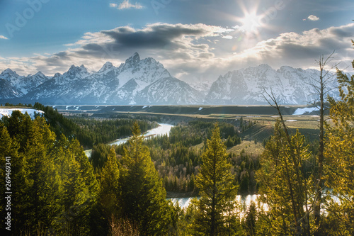 Bild auf Leinwand The Snake River Overlook looks over Schwabacher's Landing and Snake River, the Grand Teton moutain range in the distance
