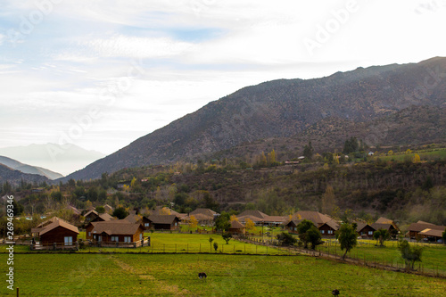 small hotel houses in the mountains. wooden. stand alone. against the backdrop of the mountains