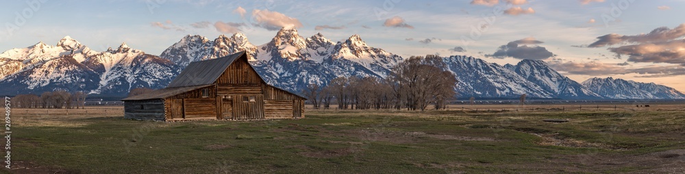 Panorama of the infamous T.A. Moulton Barn during sunrise in Mormon Row, Grand Teton National Park, Wyoming. Panorama of the infamous T.A. Moulton Barn during sunrise in Mormon Row, Grand Teton National Park, Wyoming.