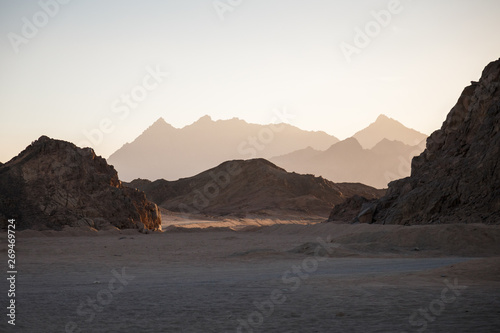 Bild auf Leinwand Sunset in bedouin village with mountain view of desert near Hurghada, Egypt