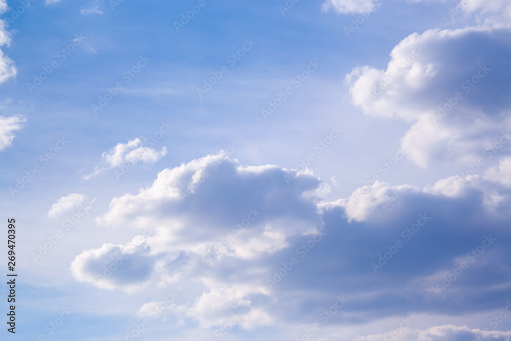 White clouds high in the sky at windy winter day background White clouds high in the sky at windy winter day background