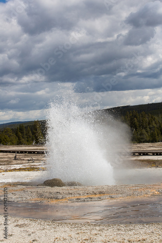The Jewel Geyser erupting in Midway Geyser Basin, Yellowstone National Park, Wyoming. Taken during mid-May in the afternoon,