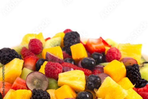 Bowl of Rainbow Colored Fruit Salad Isolated on a White Background