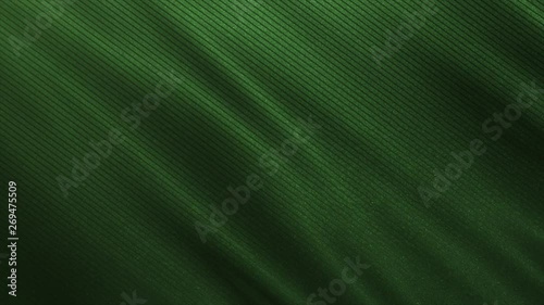 Green fabric cloth, close up waving burlap. Black green abstract material.