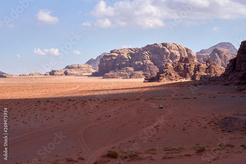 Panoramic view to the landscape of the Wadi Rum desert with red sand dunes and rocks in Jordan. 