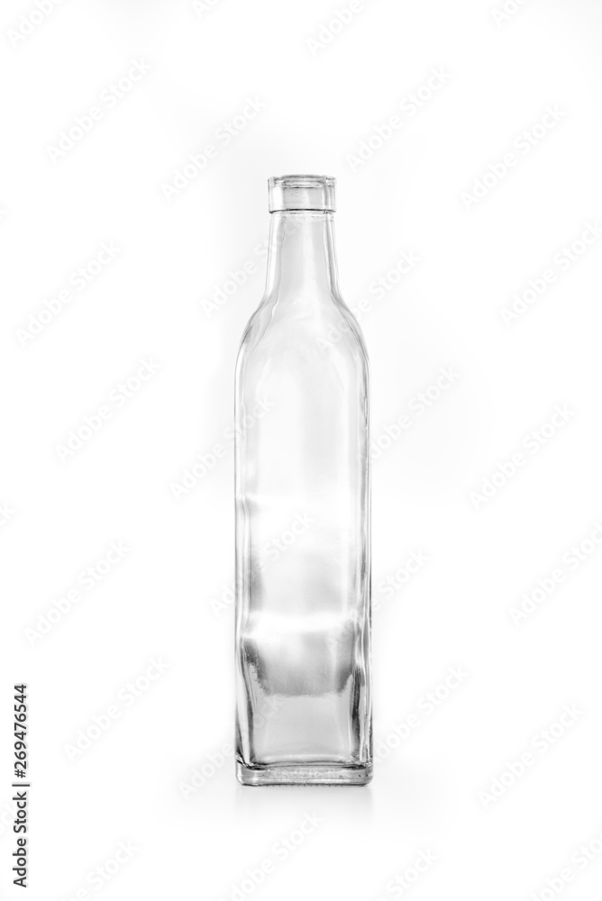 Transparent glass vintage boho style distorted bottle on a white background