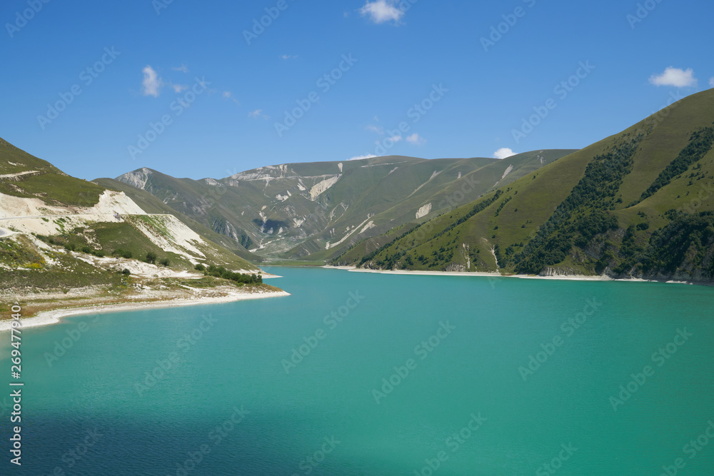 Panoramic view to the landscape with Lake Kezenoyam in Caucasus Mountains in Chechnya, Russia.