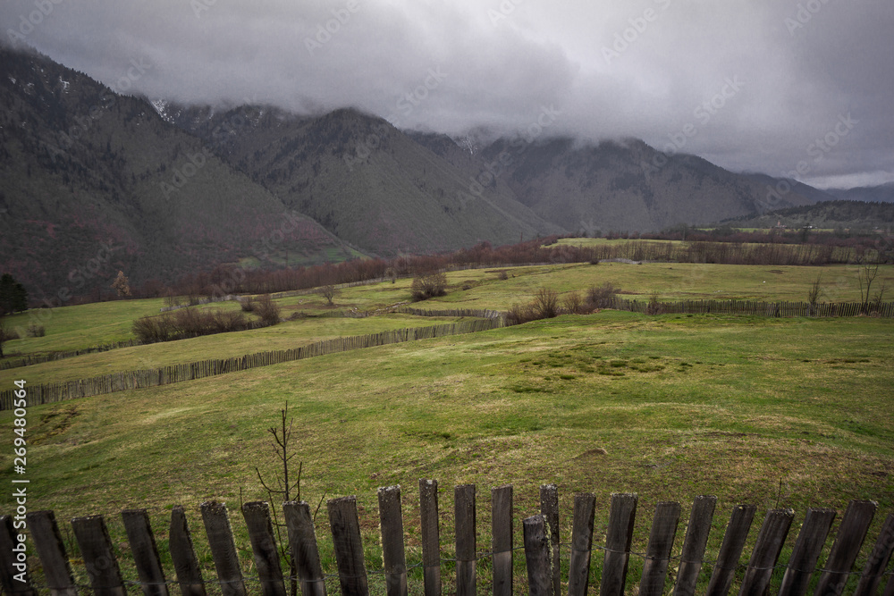 mestia meadow and wooden fence