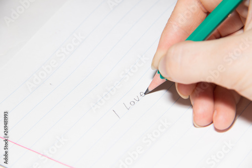 Text in pencil on paper I love you. Declaration of love on paper. Text on paper. I love you.